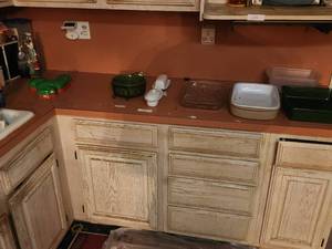 lot 157 image: Lower Kitchen cabinet contents and countertop - bring boxes or bins