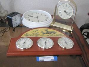 lot 40 image: Howard Miller table clock- Sterling and Noble clock - Deer design Barometer- TEMPERATURE -HUMIDITY   GAUGES