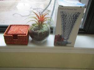 lot 60 image: diamond point base wicker coastars and wax plant
