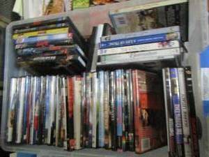 lot 71 image: clear tote of dvds legally blonde - cutting edge - oceans 13 - xxx and more