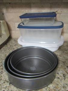 lot 95 image: 3 aluminum cake pans- covered Tupperware