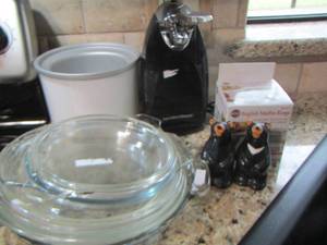lot 97 image: english muffin rings- bear salt and pepper shaker- can opener- glass pie plates