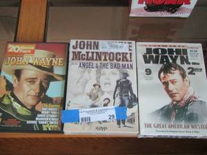 lot 29 image: John Wayne 20 movie pack- 2 dvd sets of john Wayne- 9 feature films