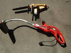 lot 179 image: Black  & Decker electric weed eater - 16 McCulloch chainsaw