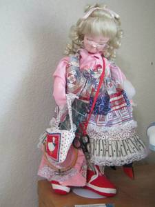 lot 203 image: plush doll on stand grandma sewing