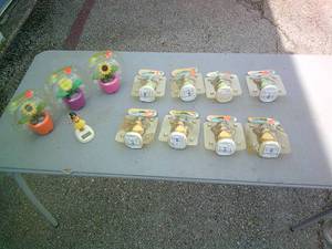 lot 52 image: 12-Solar Motion Novelties Hula Girls And Flowers, Most In Packages