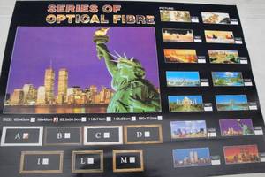 lot 139 image: Twin Towers  We Love America Fiberoptic  Motion Sign With Mirrored Frame, About 38 x 19. NOTE Top Left And Bottom Right Corners Of Frame Are Broken