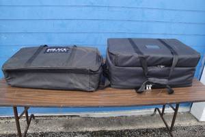 lot 134 image: Lot Of 2-Black Soft Sided Product Cases With Removeable Multi Slot Foam, Hand And Shoulder Straps. Different Sizes