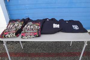 lot 187 image: 6 - (1-S, 1-L, 3-2X & 1-5X ) Black Tee Shirts- NOTE Mixed Styles, Yours will Vary, Photos Are Examples Only, NOTE 10-X Money