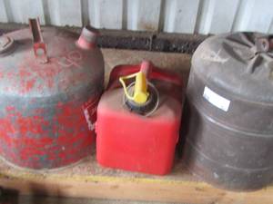 lot 67 image: 2 aluminum gas cans, red gas can