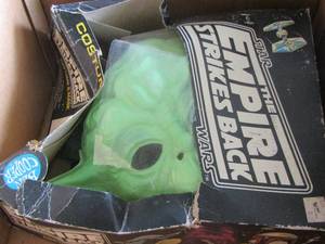 lot 134 image: Star wars- the empire strikes back costume & mask in box has damage