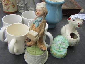 lot 165 image: 4 coffee cups, blue vase, unicorn water globe, musical little boy bay figurines