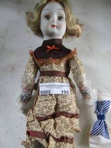 lot 195 image: porcelain white doll with hair bow