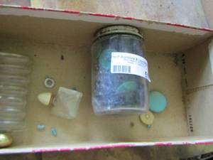 lot 516 image: various buttons and perfume bottles