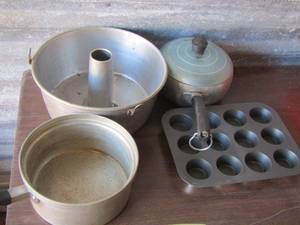 lot 390 image: cake pan- small covered sauce pan - mini muffin pan and a sauce pan