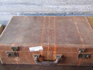 lot 409 image: suitcase full of fabric