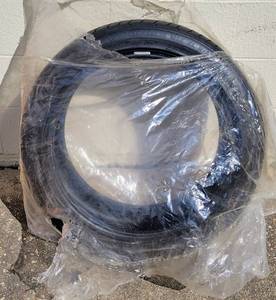 lot 132 image: COSMO BRAND TIRE APPEARS NEW