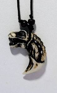 lot 136 image: CARVED T-REX PENDANT NECKLACE