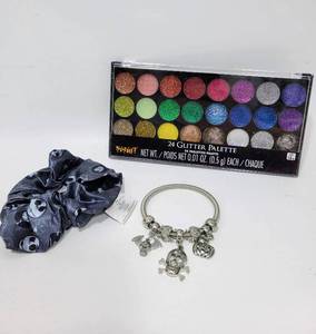 lot 227 image: SPIRIT 24 COLOR GLITTER PALLET, HALLOWEEN CHARM BRACELET AND A JACK SKELLINGTON HAIR TIE