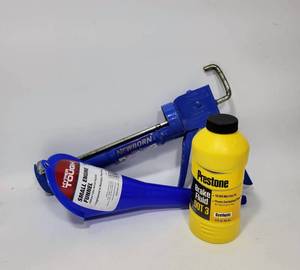 lot 230 image: CAULK GUN, NEW FUNNEL AND BRAKE FLUID (NEW, SEALED)