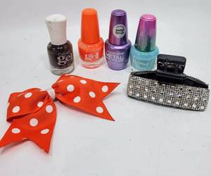 lot 411 image: NAIL POLISH AND HAIR CLIPS