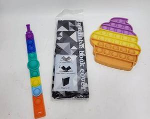 lot 403 image: FIDGET POPPERS AND A BOOK COVER