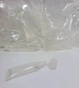 lot 383 image: EMPTY LIP GLOSS TYPE TUBS WITH TOPS AND LIDS