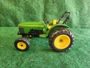 lot 11 image: John Deere diecast toy tractor