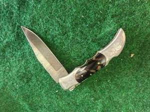 lot 88 image: Custom made Damascus knife in leather sheath