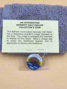 lot 94 image: 1999 - interesting Kennedy Half-Dollar collectors coin - statehood quarters image imposed on face