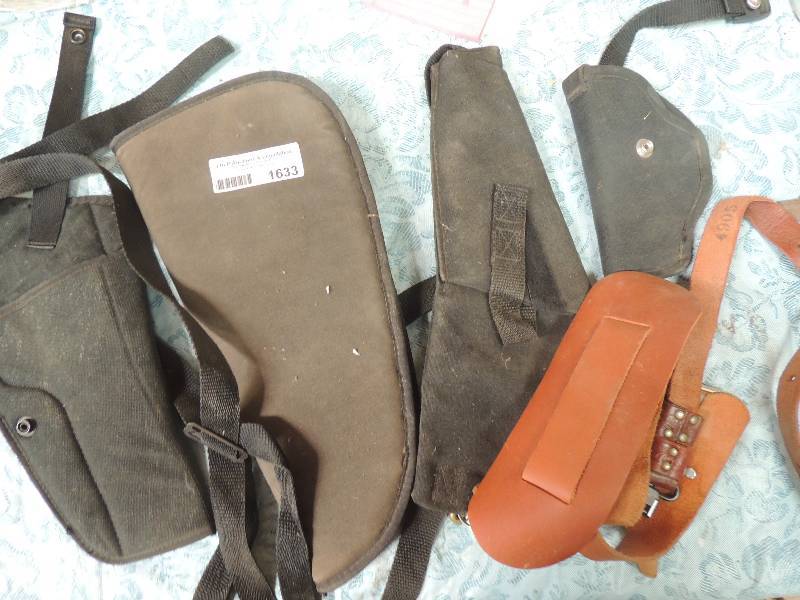lot 1633 image: 3 pistol holders and 2 rifle straps...