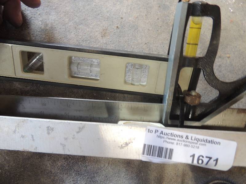lot 1671 image: level, 2 foot stanley and t square...