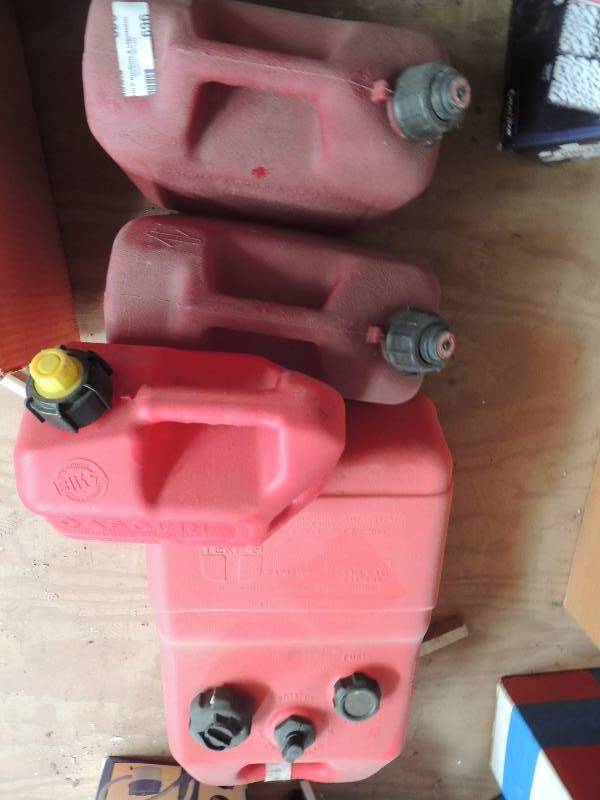 lot 696 image: 4 gas cans...