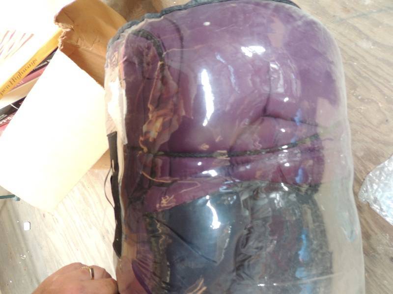 lot 721 image: Purple and black sleeping bag...