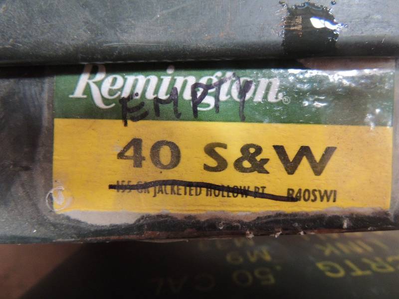lot 713 image: Metal Ammo Box full of 40 Cal Brass...