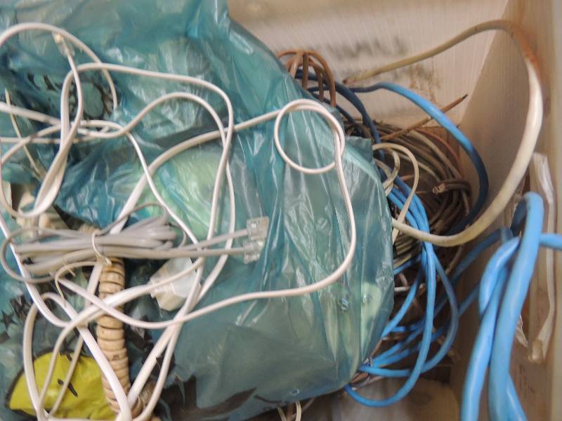 lot 757 image: Box of phone jacks and cords...