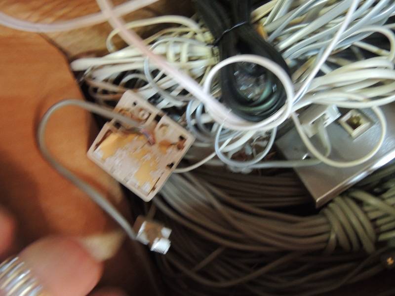 lot 758 image: Box of phone jacks and cords...