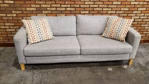 lot 24 image: Full Size Blue Grey Sofa w Throw Pillows