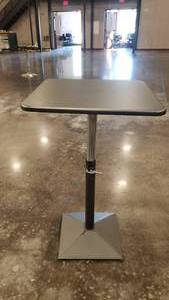 lot 160 image: Metal Industrial Style Adjustable Height Table.  Can be regular table height, bartsool height or anywhere in between.