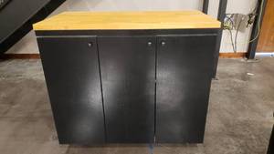 lot 204 image: Large Rolling Storage Cabinet w Butcher Block Top.  Measures 49 x 43 x 25.5