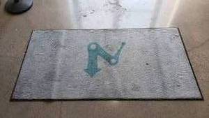 lot 229 image: American Floor Mats Commercial Entry Mat.  Measures 3 x 6