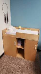lot 365 image: Wooden Nursery Cabinet w Changing Table, Pull-out Stairs & Cabinets.  Includes Everything Pictured