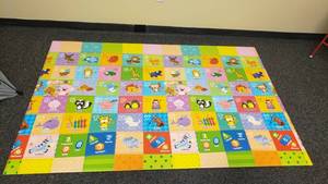 lot 406 image: Plastic Padded Baby CareBaby Play Mat.  Double Sided.  82 x 55