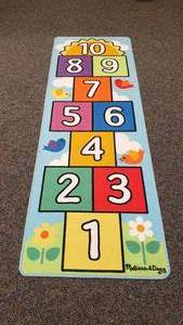 lot 415 image: Melissa & Doug Hopscotch RunnerRug.  79 x 27