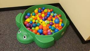 lot 429 image: Little Tikes Turtle Sand Box Full of Plastic Balls & Rubber Ducks