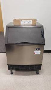 lot 524 image: WOW  Manitowoc Ice Half Cube NEO Undercounter Ice Machine, Model UY0140A-161B.  Makes 137lbs of ice per DAY