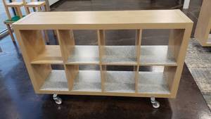lot 548 image: Ikea Kallax Natural 8 Shelf Shelving Unit w ROLLERS.  Measures 59 x 31 x 15