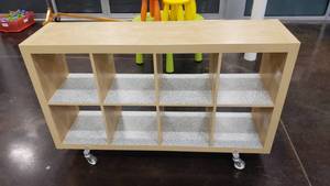 lot 550 image: Ikea Kallax Natural 8 Shelf Shelving Unit w ROLLERS.  Measures 59 x 31 x 15