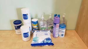 lot 562 image: Lot of Misc Hygiene Supplies.  Wipes, Hand Sanitizer, Spray & More