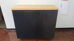 lot 607 image: Large Rolling Storage Cabinet w Butcher Block Top.  Measures 49 x 43 x 25.5